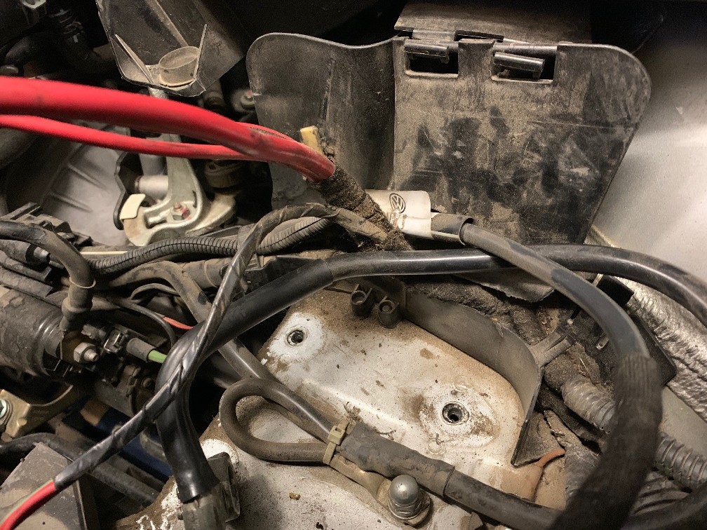 Melted battery fusebox and damaged positive battery wiring.